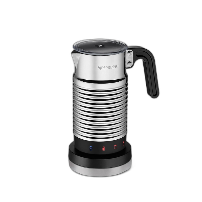 Nespresso Aeroccino4 Pouring Milk Foam Over Espresso Nespresso Aeroccino4 Milk Frother pouring hot frothed milk over espresso, demonstrating easy operation for home coffee drinks